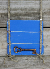 Blank blue sign with skeleton key