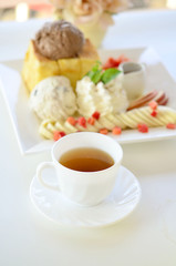 cup of tea and honey toast with with fruit and ice cream