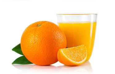 Glass with orange juice and fruits with green leaves isolated
