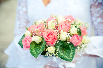 Wedding bouquet in hands of the bride