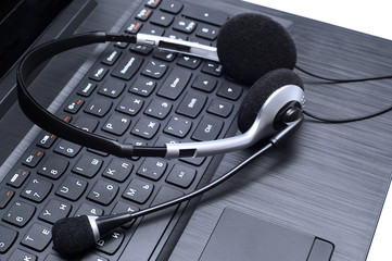 Headset lying on a laptop computer keyboard