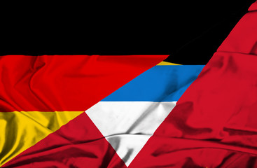 Waving flag of Antigua and Barbuda and Germany