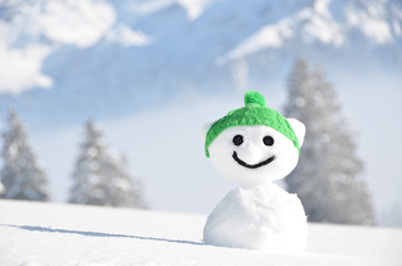 Snowman against Alpine scenery
