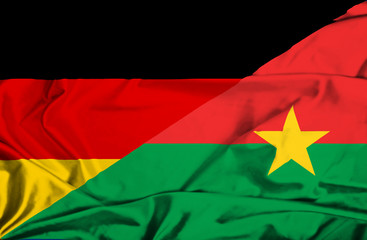 Waving flag of Burkina Faso and Germany