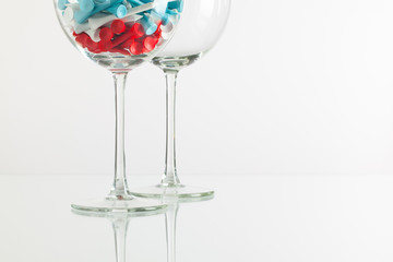 Two glasses of wine and golf equipments