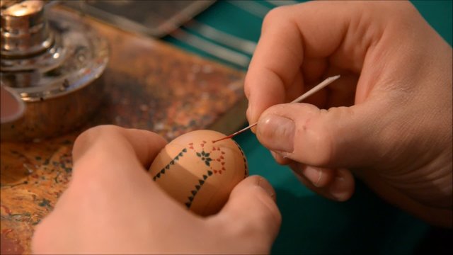 Painting a sorbian easter egg close up