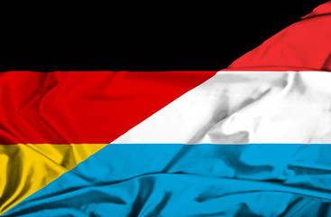 Waving flag of Luxembourg and Germany