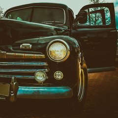 Old retro or vintage car front side. Vintage effect processing