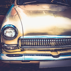 Old retro or vintage car front side. Vintage effect processing