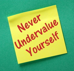 Never Undervalue Yourself yellow sticky note