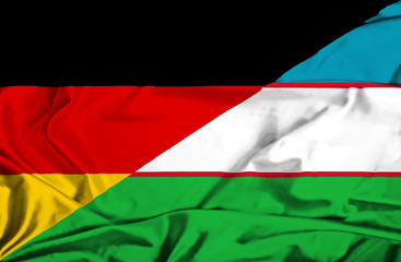 Waving flag of Uzbekistan and Germany