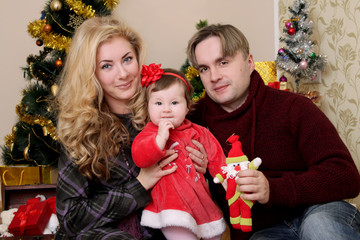 Mother and father with little baby girl