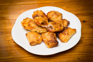 Panzerotti ripieni di mozzarella e pomodoro, italian cuisine
