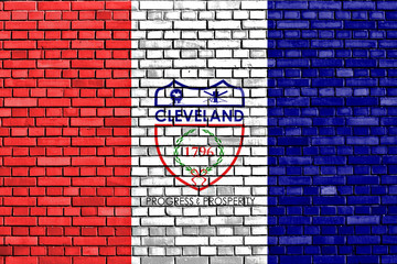 flag of Cleveland painted on brick wall