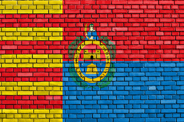 flag of Elche painted on brick wall