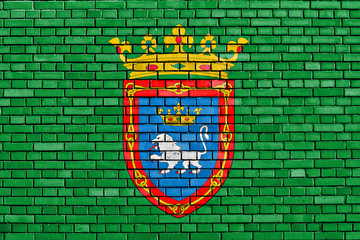 flag of Pamplona painted on brick wall
