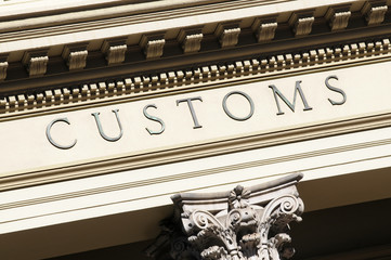 Customs sign on a government building import export photo