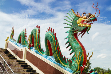 Fototapeta premium Dragon sculpture on staircase rail