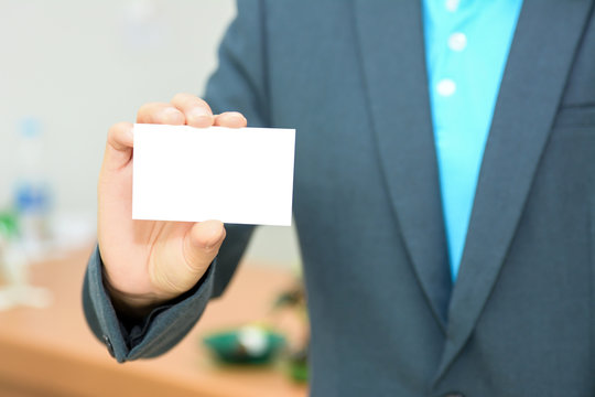Business woman holding name card