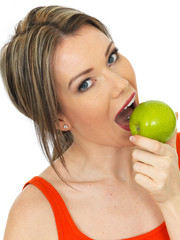 Young Woman Holding a Fresh Ripe Green Apple
