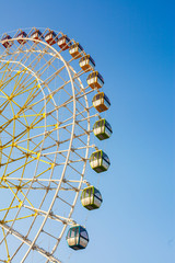 Ferris wheel against the blue sky