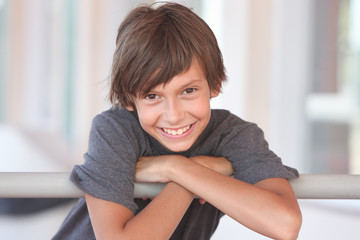 portrait of a happy preteen boy outdoors smiling and looking at camera © atikinka2