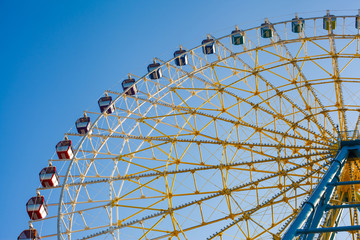 Ferris wheel against the blue sky