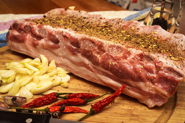 Fresh pork ribs, meat marinated and prepared for roast