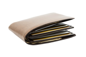 Money in brown leather wallet full of cards on white background