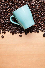 Cup on coffee beans