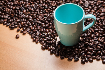 Cup on coffee beans