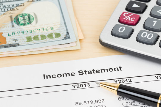 Income statement financial report with pen, banknote, and calcul