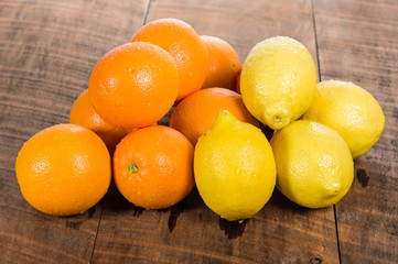 Citrus oranges and lemons on table