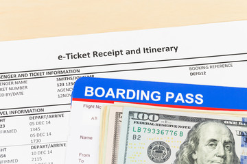 E-ticket with banknote, and boarding pass