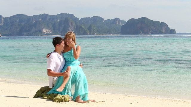 attractive blonde asian girl communicate with handsome man sitt