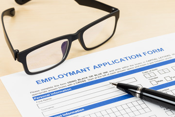 Employment application form with pen and glasses concept job app