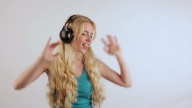 Girl with headphones dancing