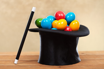 The magic of easter - colorful eggs in magician hats