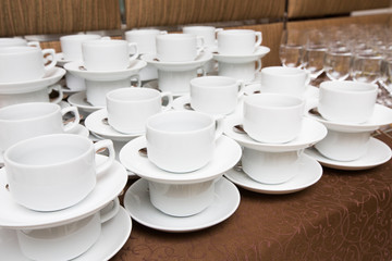 Fototapeta na wymiar Catering - rows of cups served for tea table