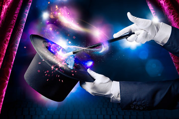 High contrast image of magician hand with magic wand - obrazy, fototapety, plakaty