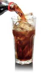 glass of cola with ice on wood