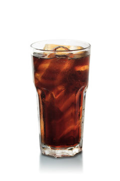 glass of cola with ice on wood