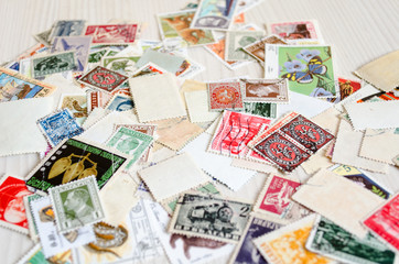 Fototapeta na wymiar Backdrop of old postage stamps