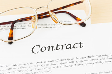 Business contract document with glasses