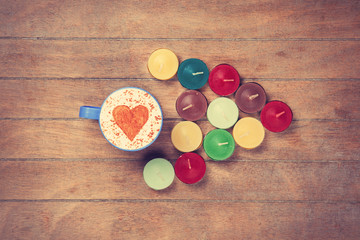 Cup and candles on a talbe