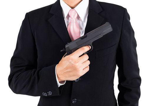 Businessman pull out gun concept for aggression