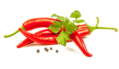Hot red chili or chilli pepper and parsley leaves still life iso