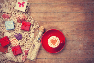 Cup, gift and net with shells and bottle