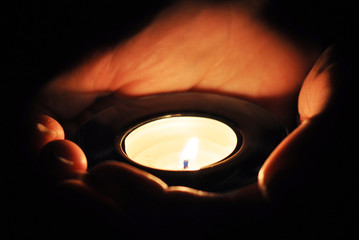 Candle in the hands
