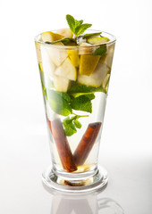 Tea with cinnamon, flowers and fruits